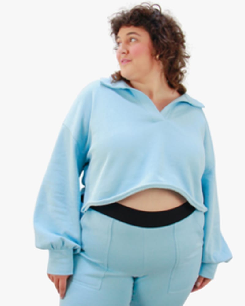 Front of a model wearing a size L Polo Sweatshirt in Sky by Lovefool. | dia_product_style_image_id:249785